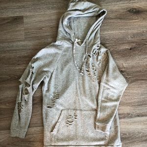 Ripped up grey hoodie with lots of holes